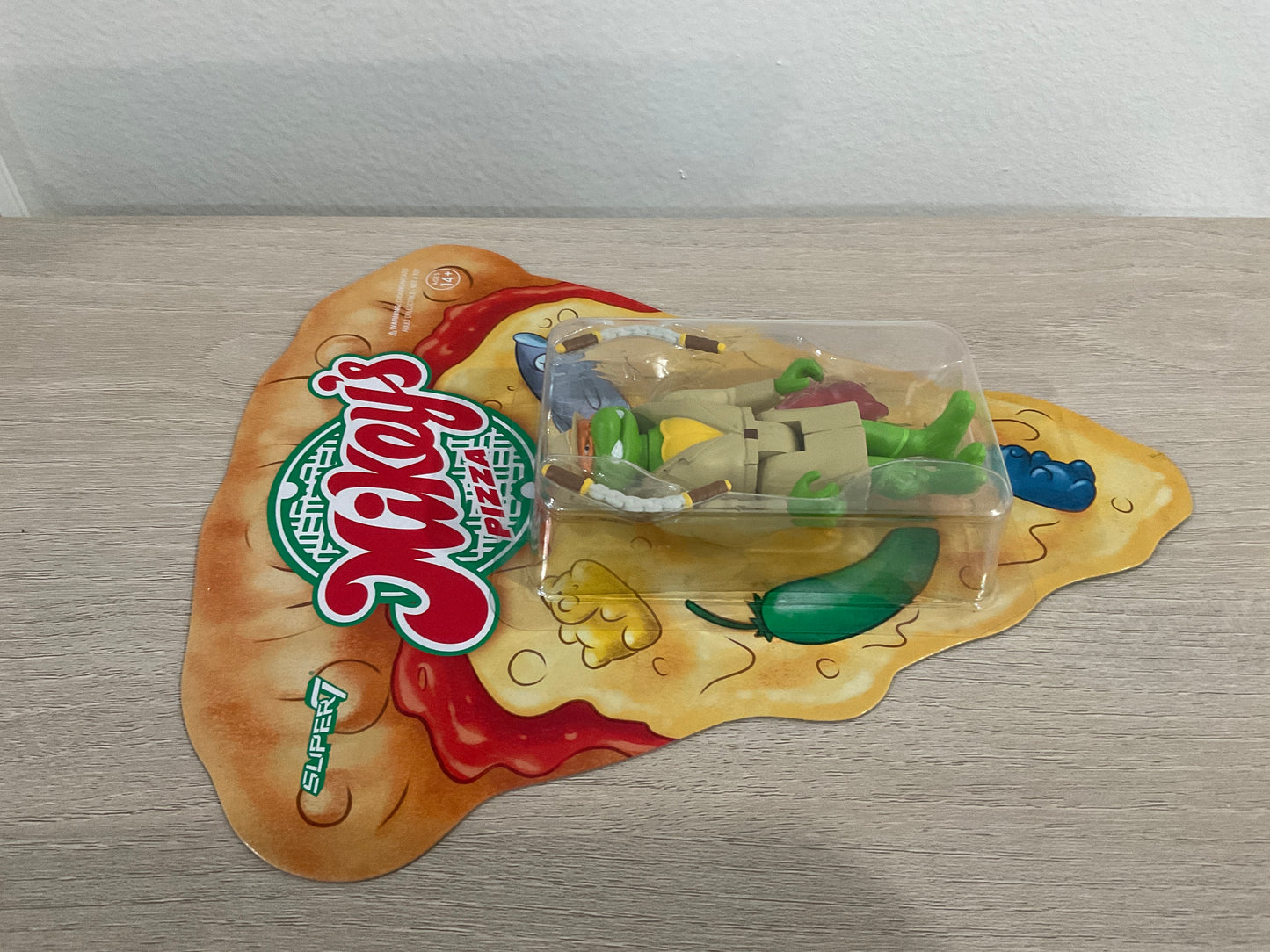Super7 ReAction Teenage Mutant Ninja Turtles – Undercover Michelangelo “Weird Pizza To Go” 3.75-Inch Figure