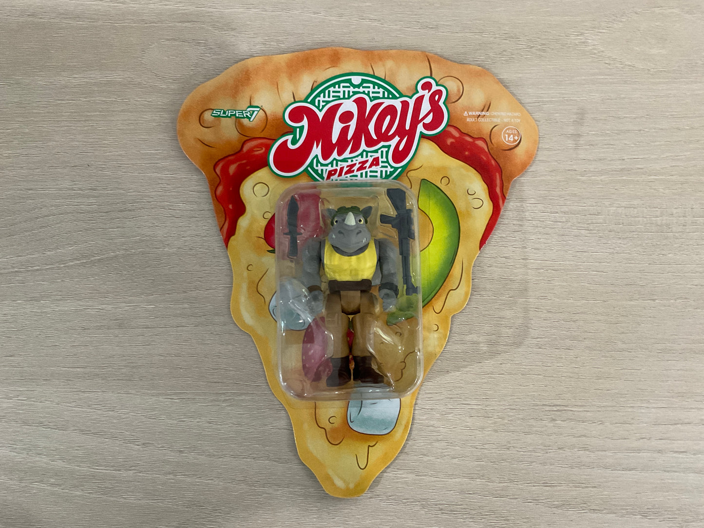 Super7 ReAction Teenage Mutant Ninja Turtles – Rocksteady “Weird Pizza To Go” 3.75-Inch Figure